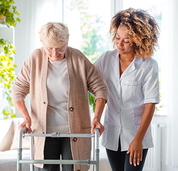 Reablement team assisting a patient at home